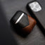 Two-tone black and brown leather AirPods case TERRA with embossed pullstrap logo